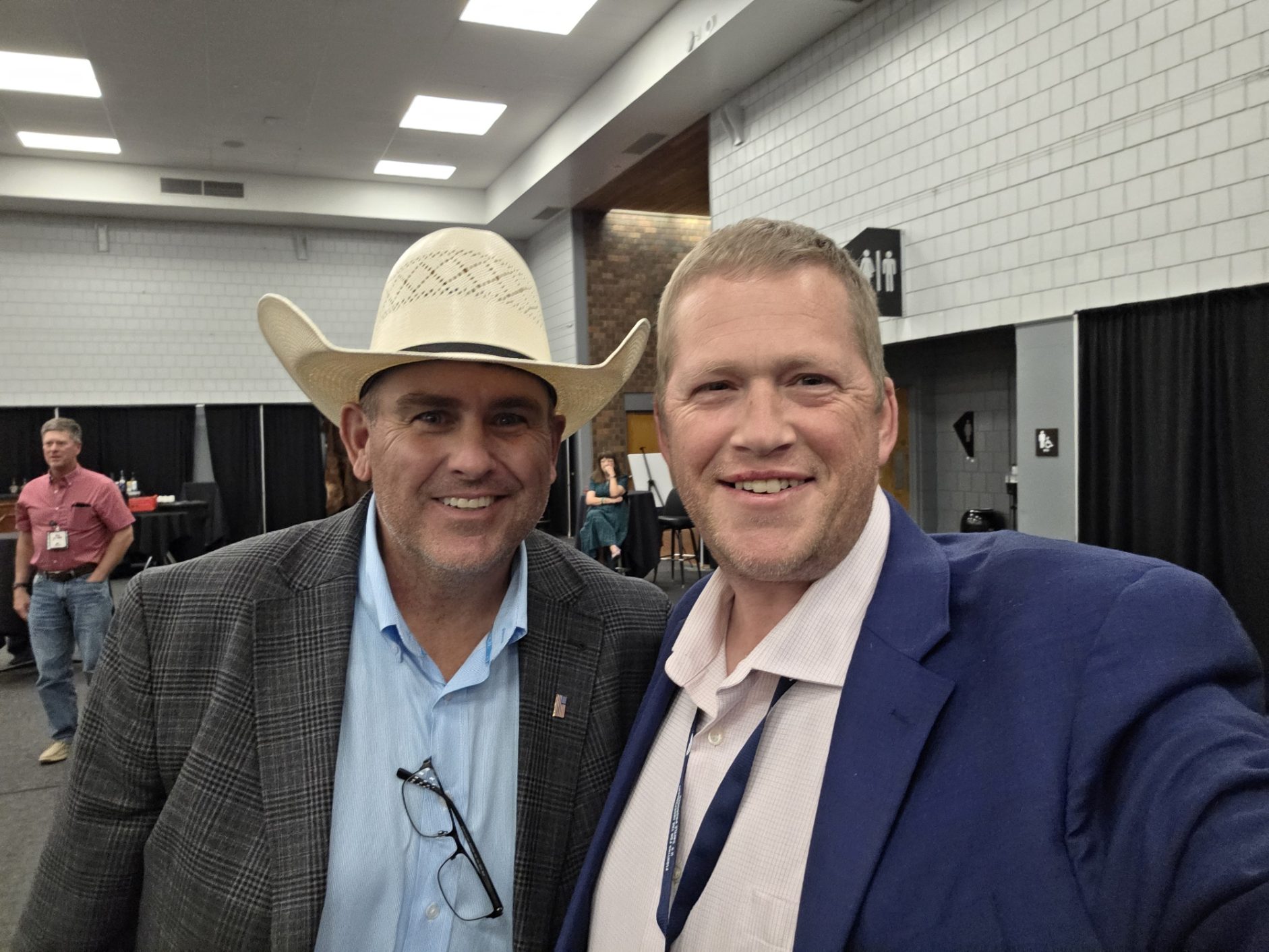 Michael Boyle standing with rancher and property-rights advocate Shad Sullivan at the 2026 R-CALF convention.