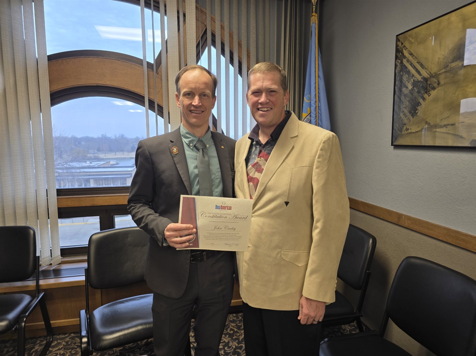 Michael Boyle presenting a JBS Legislative Certificate to Sen. John Carley